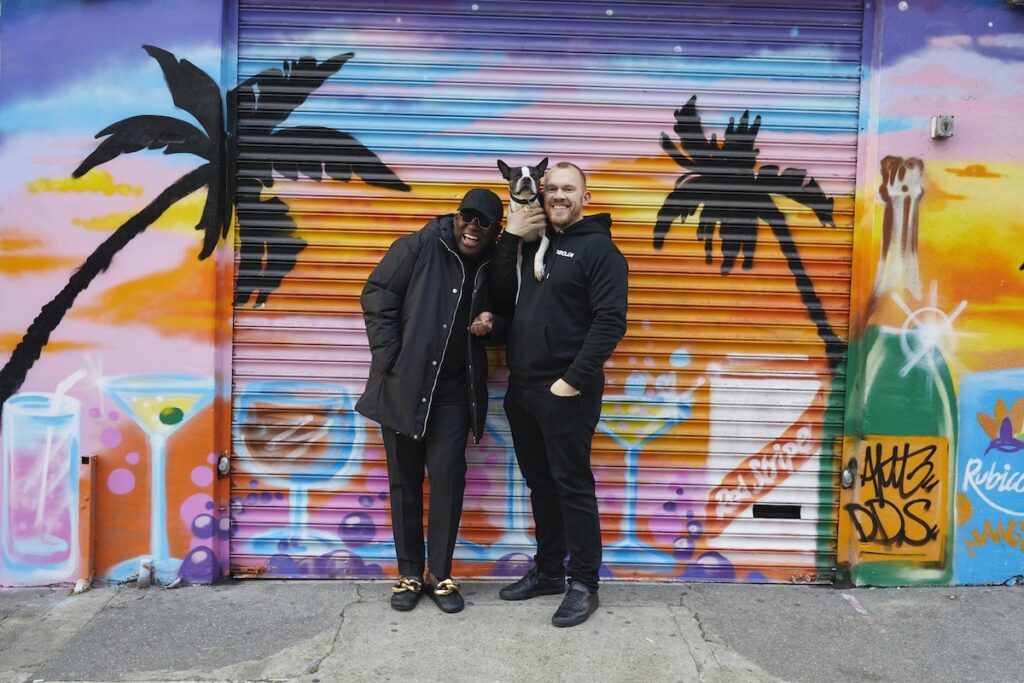 Edward Enninful laughs with his husband Alec Maxwell and dog Ru