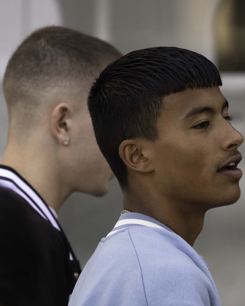Close-up of two young person with fade haircuts