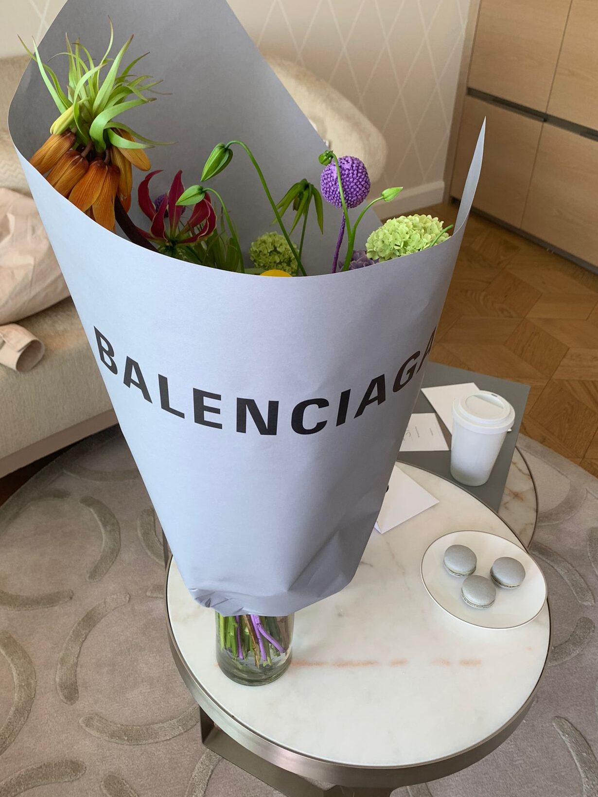 Flowers wrapped in Balenciaga paper